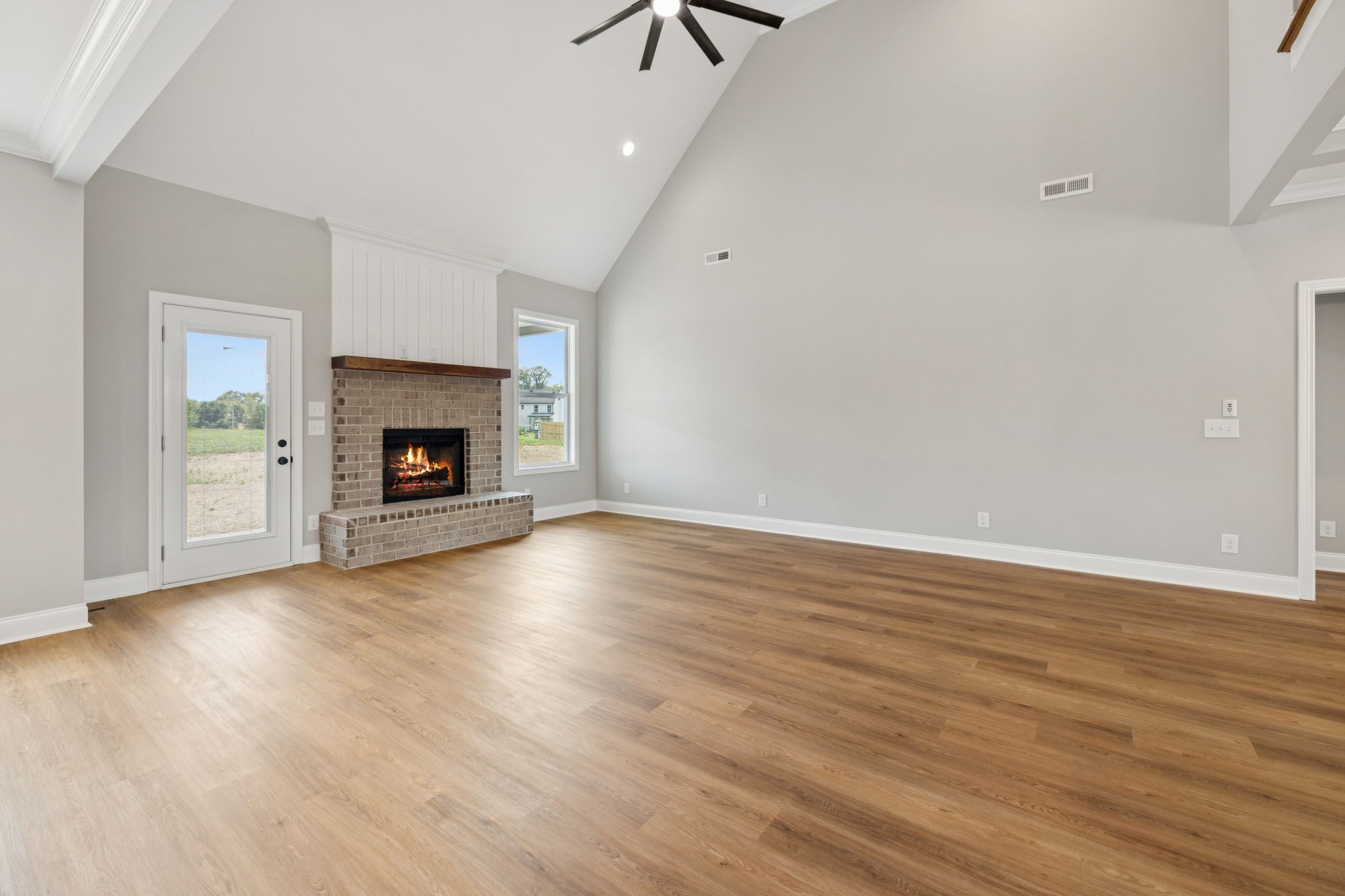28 Faith Lane Lebanon, TN 37087 - Photo 10 of 53 a view of an empty room with wooden floor fireplace and a window