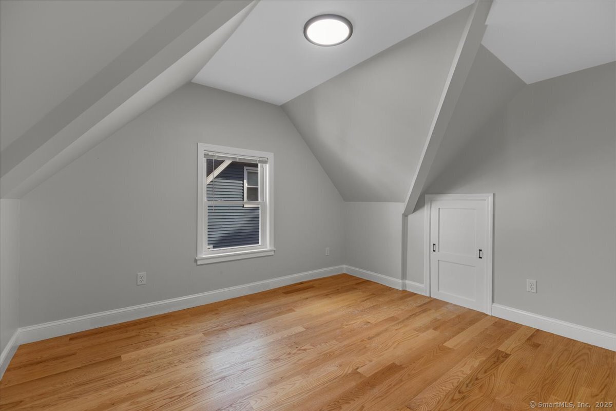 36 Maple Street, Unit 3 New Haven, CT 06511 - Photo 12 of 20 an empty room with wooden floor and windows