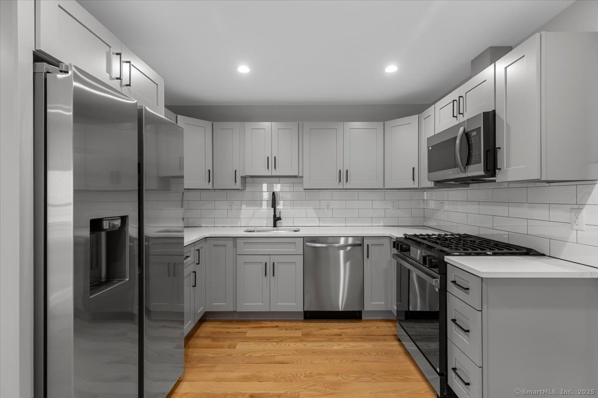 36 Maple Street, Unit 3 New Haven, CT 06511 - Photo 4 of 20 a kitchen with stainless steel appliances granite countertop a stove a sink and a refrigerator