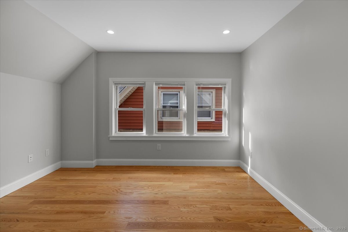 36 Maple Street, Unit 3 New Haven, CT 06511 - Photo 8 of 20 wooden floor in an empty room with a window