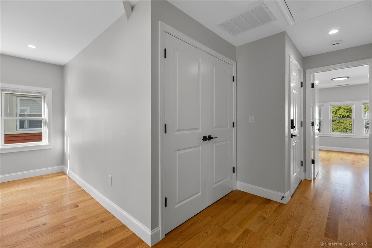 36 Maple Street, Unit 3 New Haven, CT 06511 - Photo 10 of 20 a view of hallway with window and wooden floor