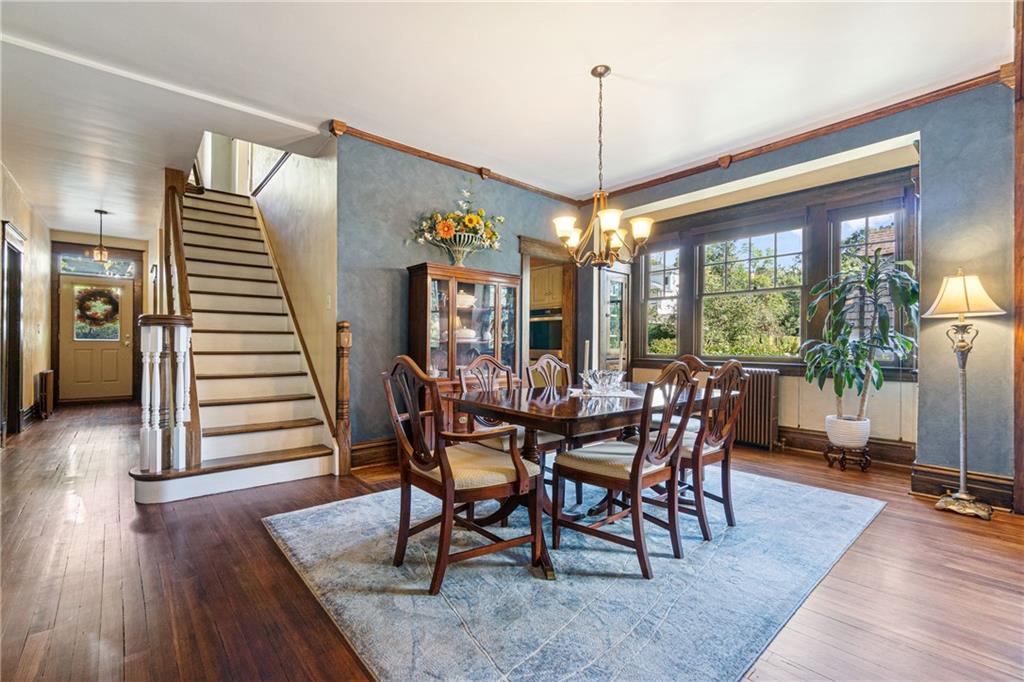 664 Hamilton Road Pittsburgh, PA 15205 - Photo 11 of 43 a view of a dining room with furniture window and wooden floor