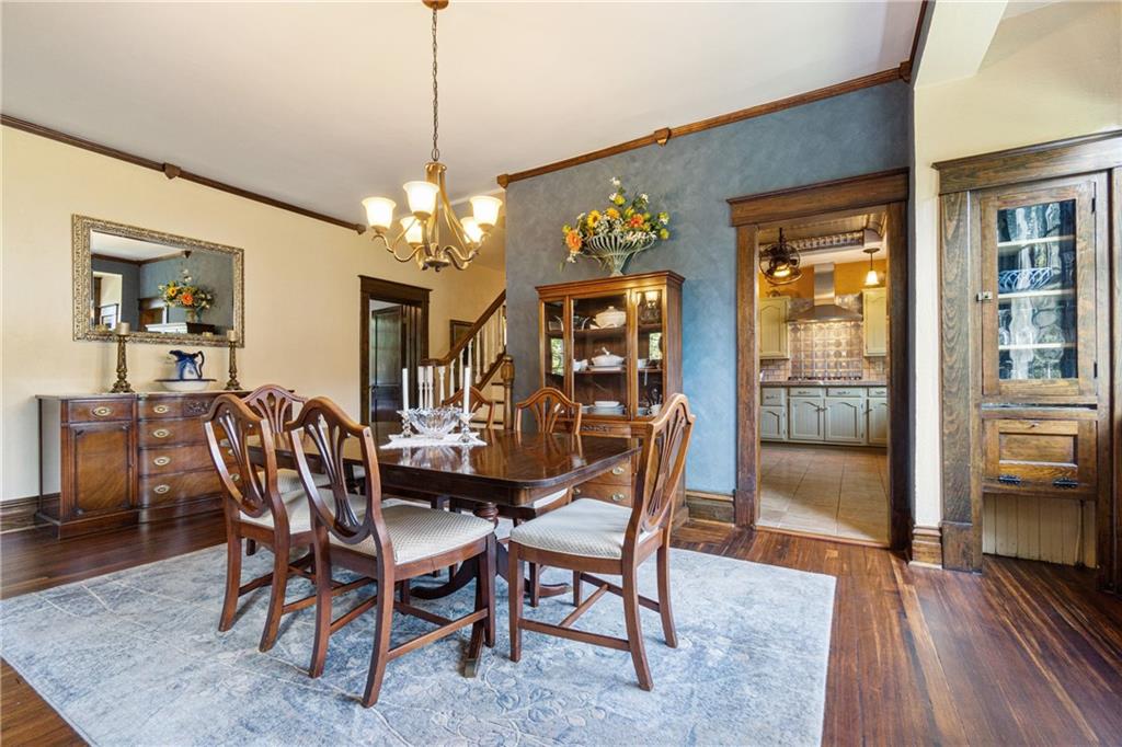 664 Hamilton Road Pittsburgh, PA 15205 - Photo 12 of 43 a dining room with furniture a chandelier and wooden floor