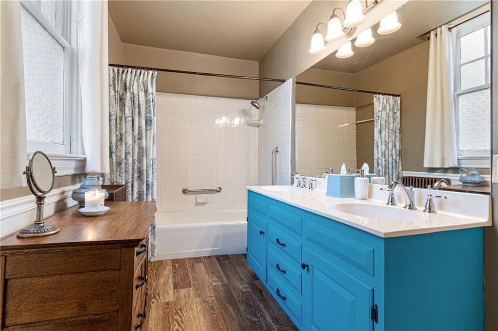 664 Hamilton Road Pittsburgh, PA 15205 - Photo 19 of 43 a bathroom with a double vanity sink mirror and shower