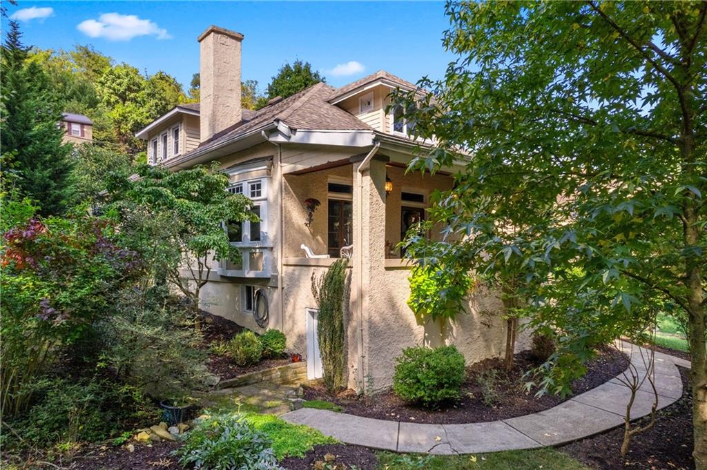 664 Hamilton Road Pittsburgh, PA 15205 - Photo 2 of 43 a front view of a house with garden