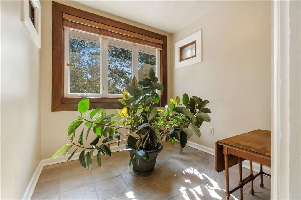 664 Hamilton Road Pittsburgh, PA 15205 - Photo 23 of 43 a glass vase with white and yellow flowers