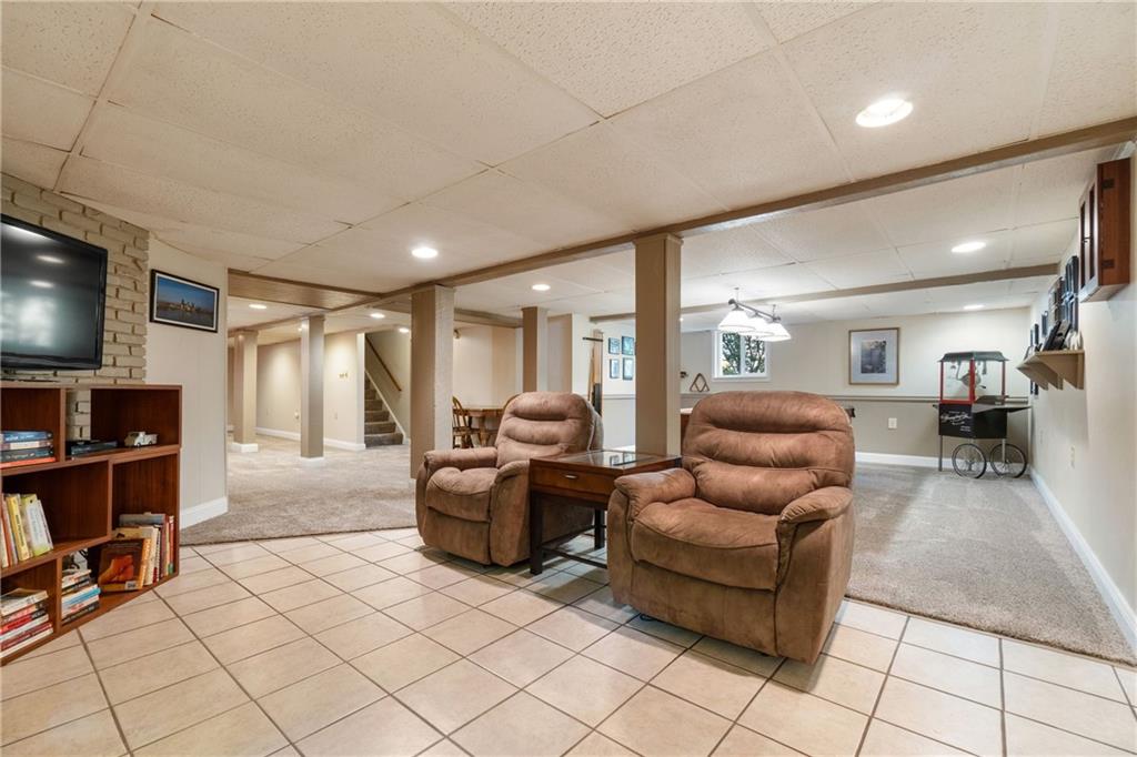 664 Hamilton Road Pittsburgh, PA 15205 - Photo 31 of 43 a living room with furniture and a flat screen tv