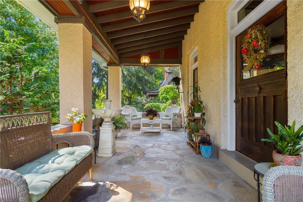 664 Hamilton Road Pittsburgh, PA 15205 - Photo 4 of 43 a living room filled with furniture and a potted plant