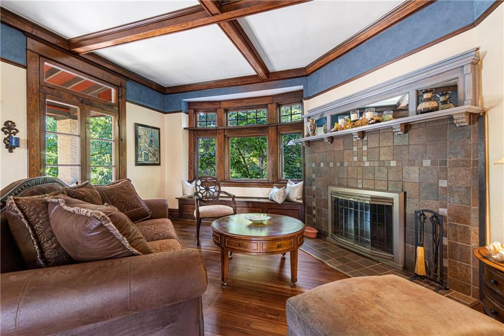 664 Hamilton Road Pittsburgh, PA 15205 - Photo 9 of 43 a living room with furniture a fireplace and a large window