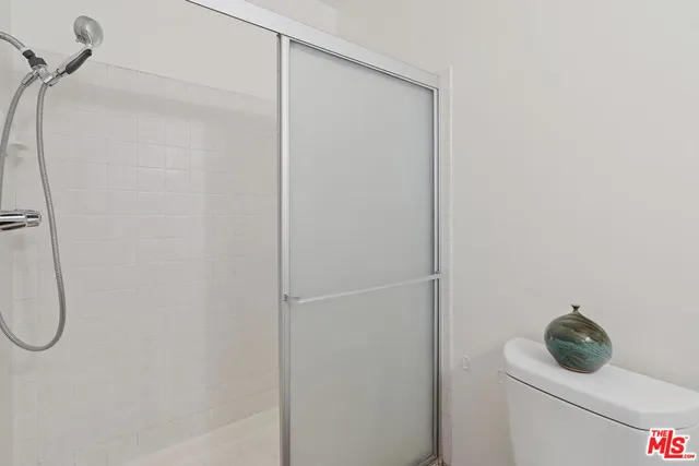 an empty room with wooden floor and window