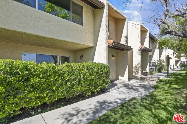 a view of a back yard of the house