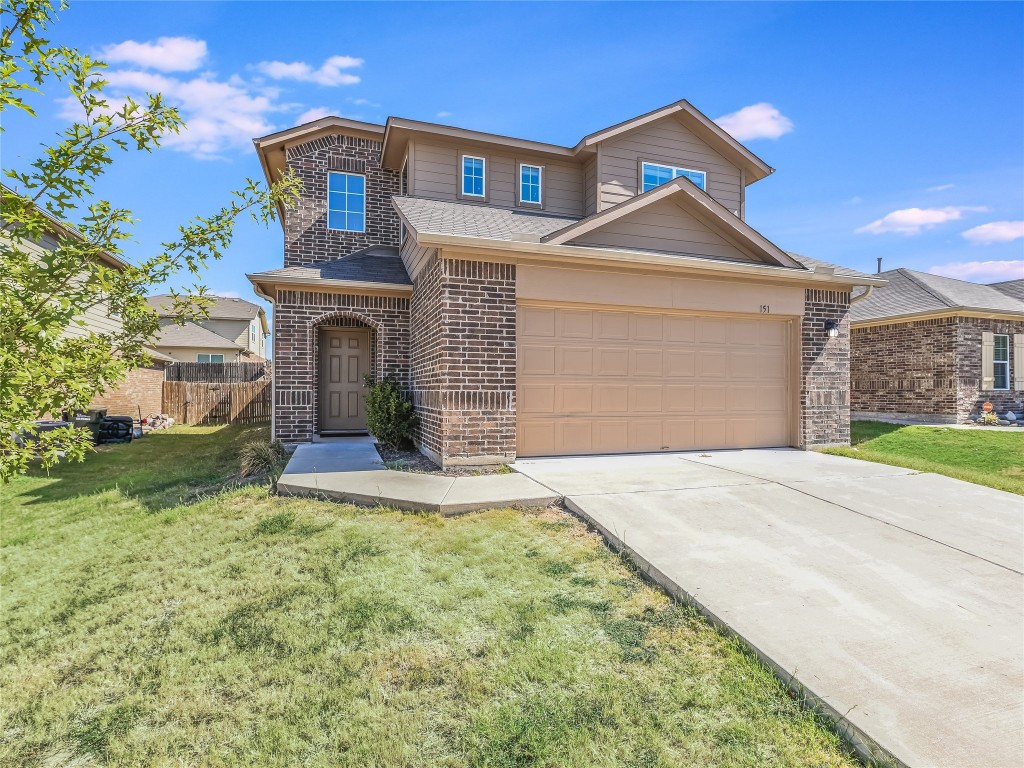 151 Song Sparrow Cove Kyle, TX 78640 - Photo 1 of 1 a front view of a house with a yard and garage