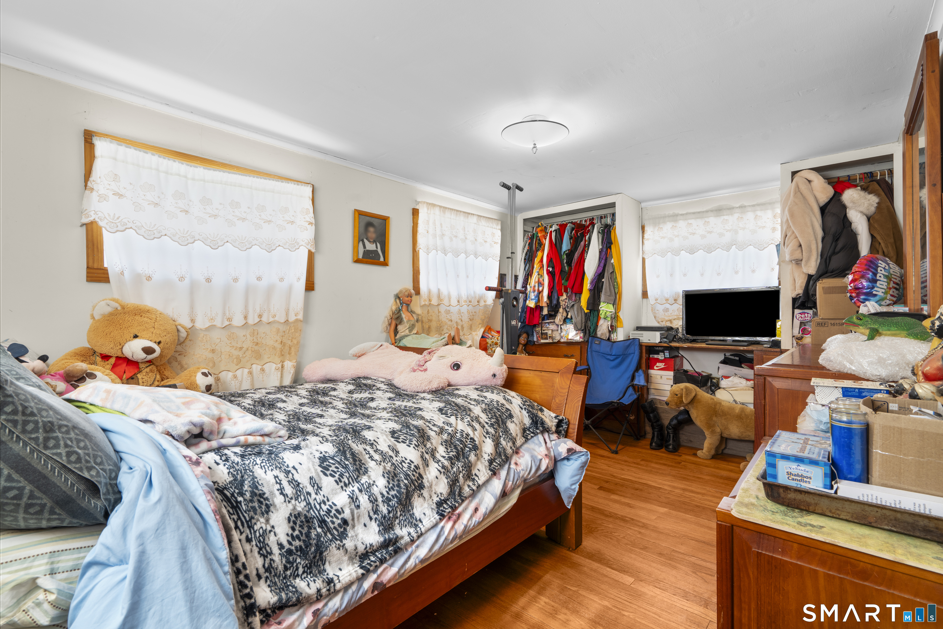 22 Tyler Circle Manchester, CT 06040 - Photo 18 of 27 a bedroom with a bed window and flat screen tv