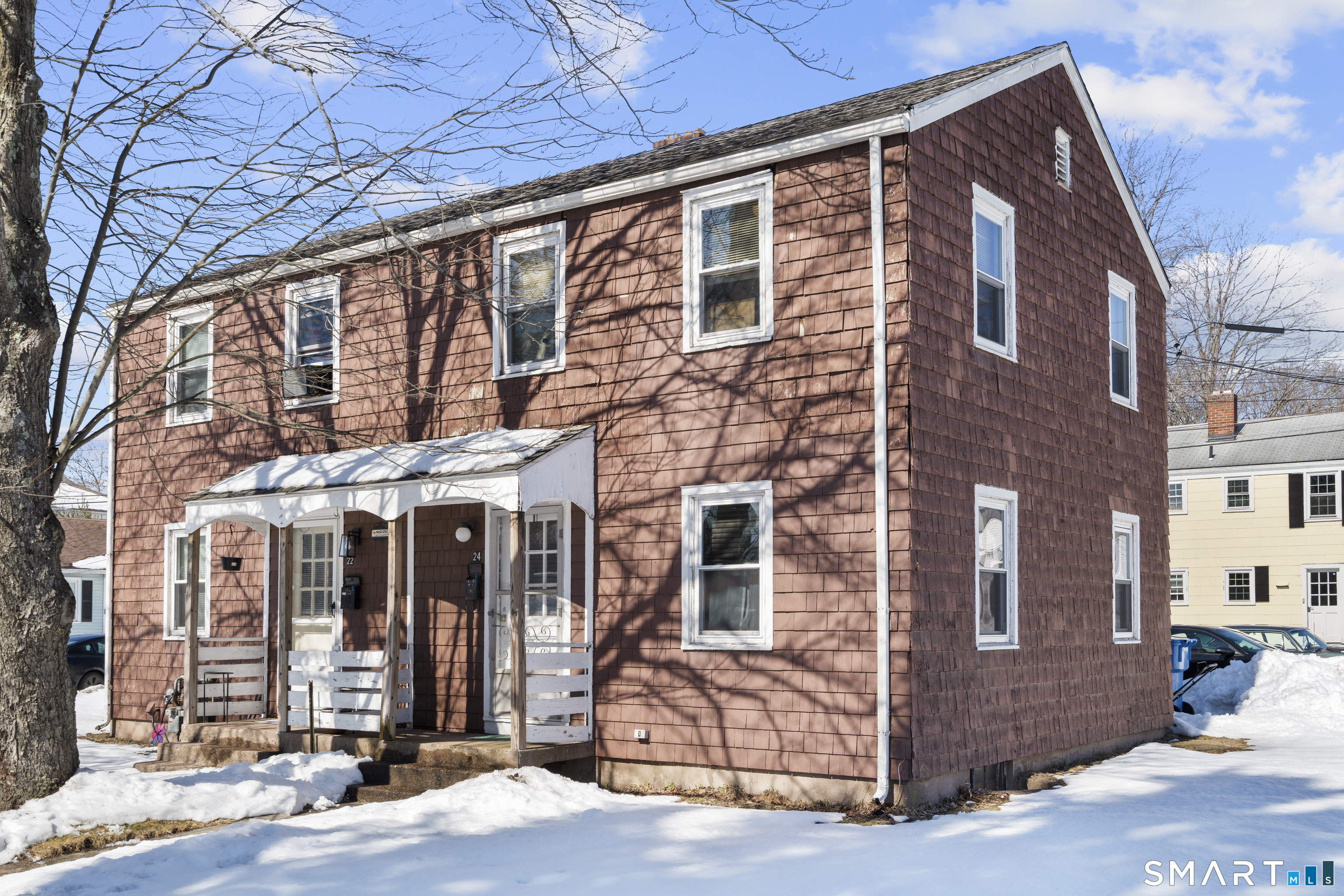 22 Tyler Circle Manchester, CT 06040 - Photo 2 of 27 a front view of a building with glass windows