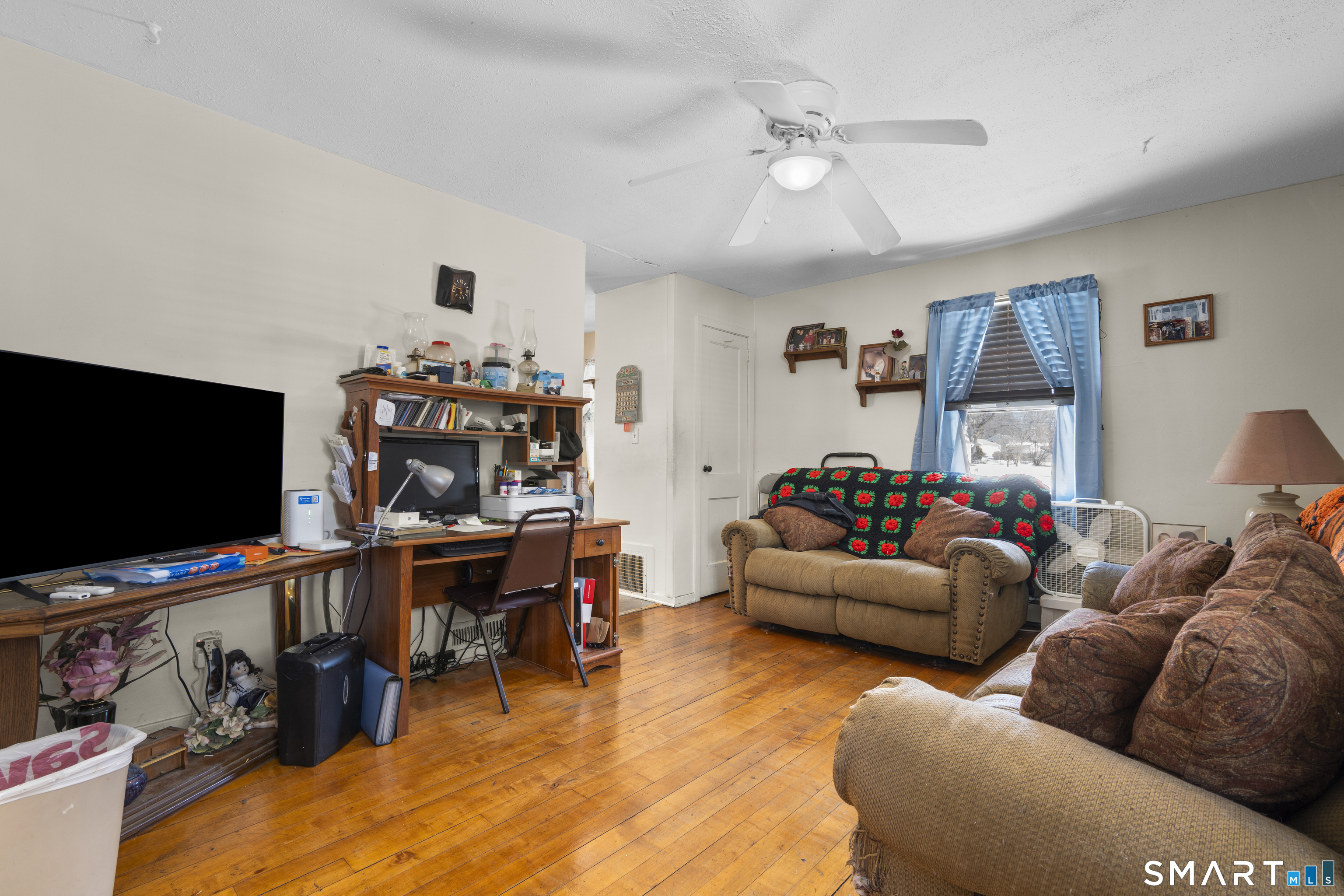 22 Tyler Circle Manchester, CT 06040 - Photo 5 of 27 a living room with furniture and a flat screen tv