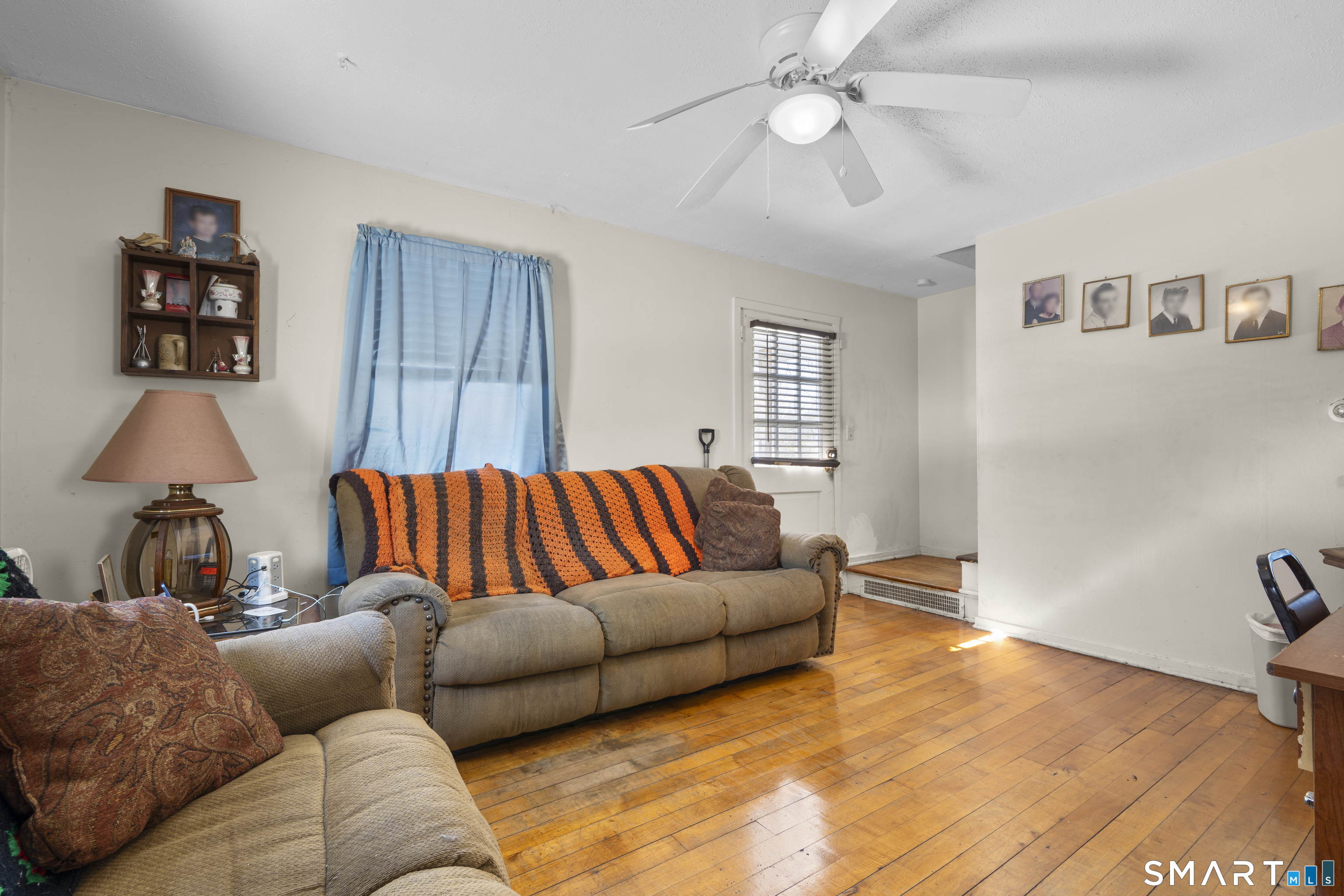 22 Tyler Circle Manchester, CT 06040 - Photo 6 of 27 a living room with furniture and a lamp