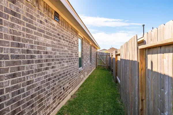 a swimming pool with wooden fence