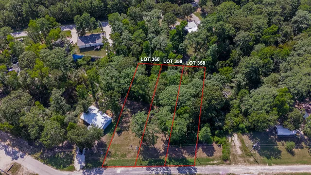 an aerial view of a house with lots of trees