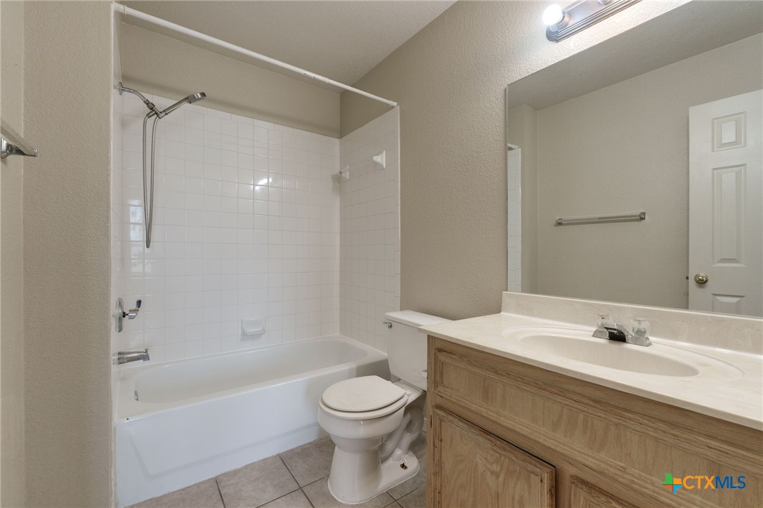 3606 Dustin Court, Unit B Killeen, TX 76549 - Photo 12 of 16 a bathroom with a sink a toilet and shower