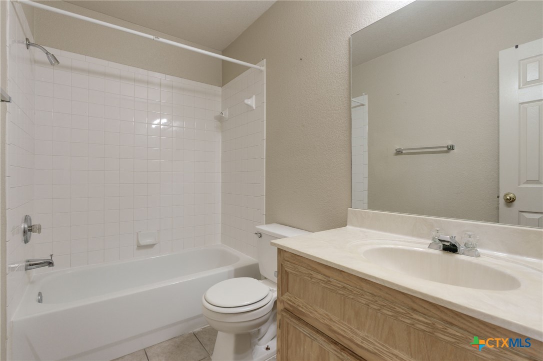 3606 Dustin Court, Unit B Killeen, TX 76549 - Photo 14 of 16 a bathroom with a sink toilet and shower