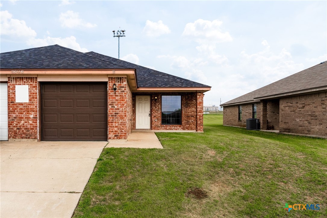3606 Dustin Court, Unit B Killeen, TX 76549 - Photo 2 of 16 a front view of a house with a yard