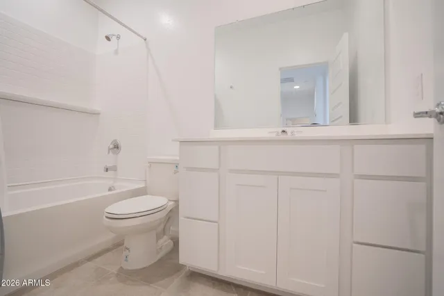 a bathroom with a sink a toilet and bathtub