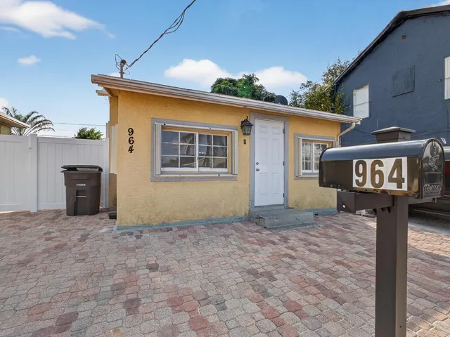 a front view of a house with yard