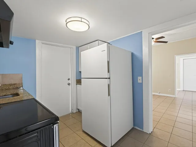 a view of a storage & utility room with closet dryer
