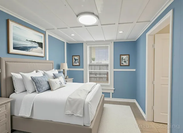 a bedroom with a bed and a painting on the wall