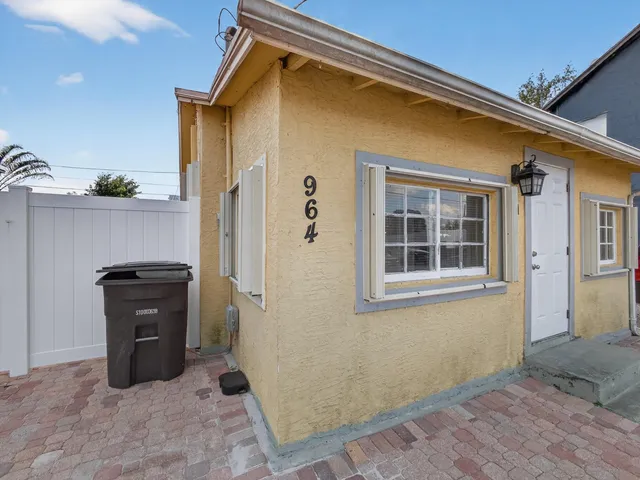 a view of a house with a black and white door