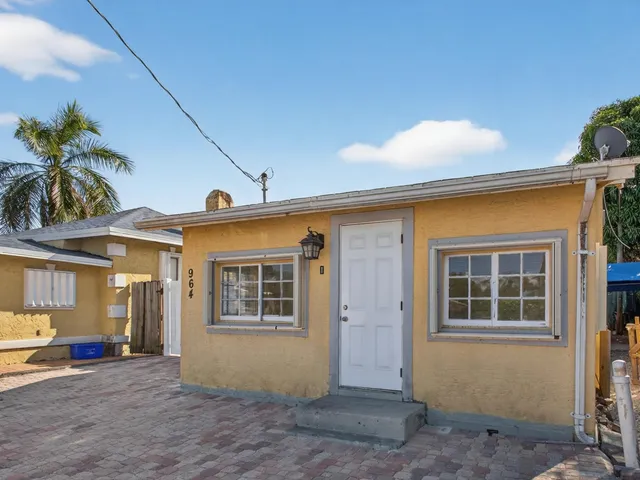 a view of house with door and outdoor space