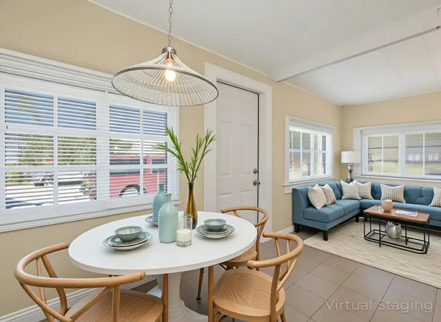 a view of a dining room with furniture and window