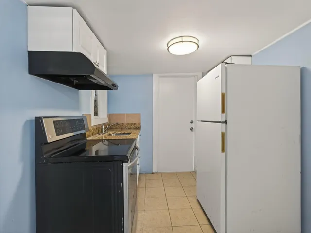 a kitchen with stainless steel appliances a stove and a refrigerator