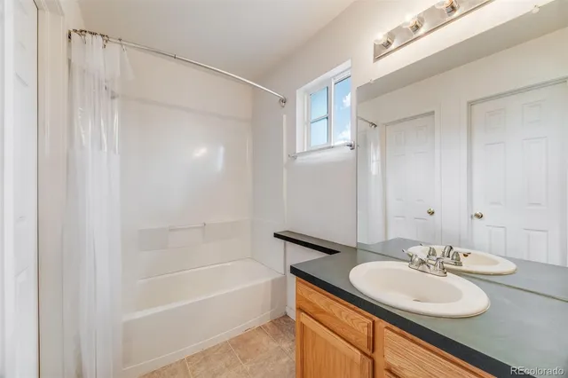 a bedroom with a bed and a chair