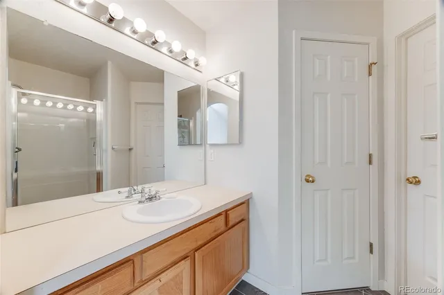 a view of empty room with stairs and furniture