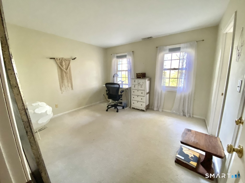 12 Carriage Hill Road Woodbridge, CT 06525 - Photo 20 of 24 a living room with furniture and a window