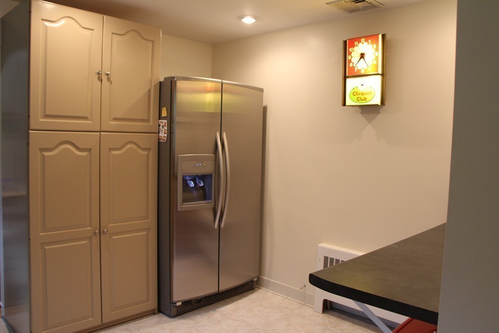 28 Deerfield Road Sharon, MA 02067 - Photo 8 of 20 a view of kitchen with stainless steel appliances wooden floor and window