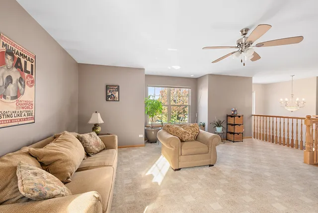 a bathroom with a granite countertop sink a toilet and a large mirror