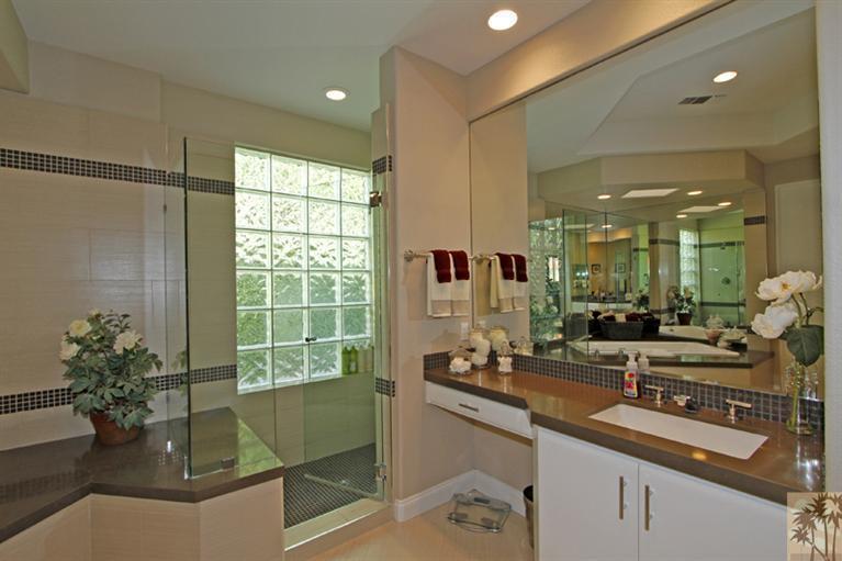 124 Loch Lomond Road Rancho Mirage, CA 92270 - Photo 15 of 25 a bathroom with a double vanity sink and mirror