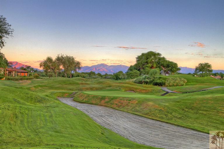 124 Loch Lomond Road Rancho Mirage, CA 92270 - Photo 23 of 25 a view of a golf course with a lake