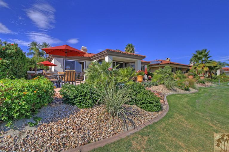 124 Loch Lomond Road Rancho Mirage, CA 92270 - Photo 24 of 25 a front view of a house with a yard