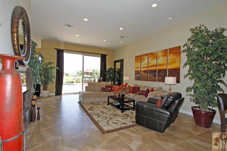 124 Loch Lomond Road Rancho Mirage, CA 92270 - Photo 6 of 25 a living room with furniture and a potted plant