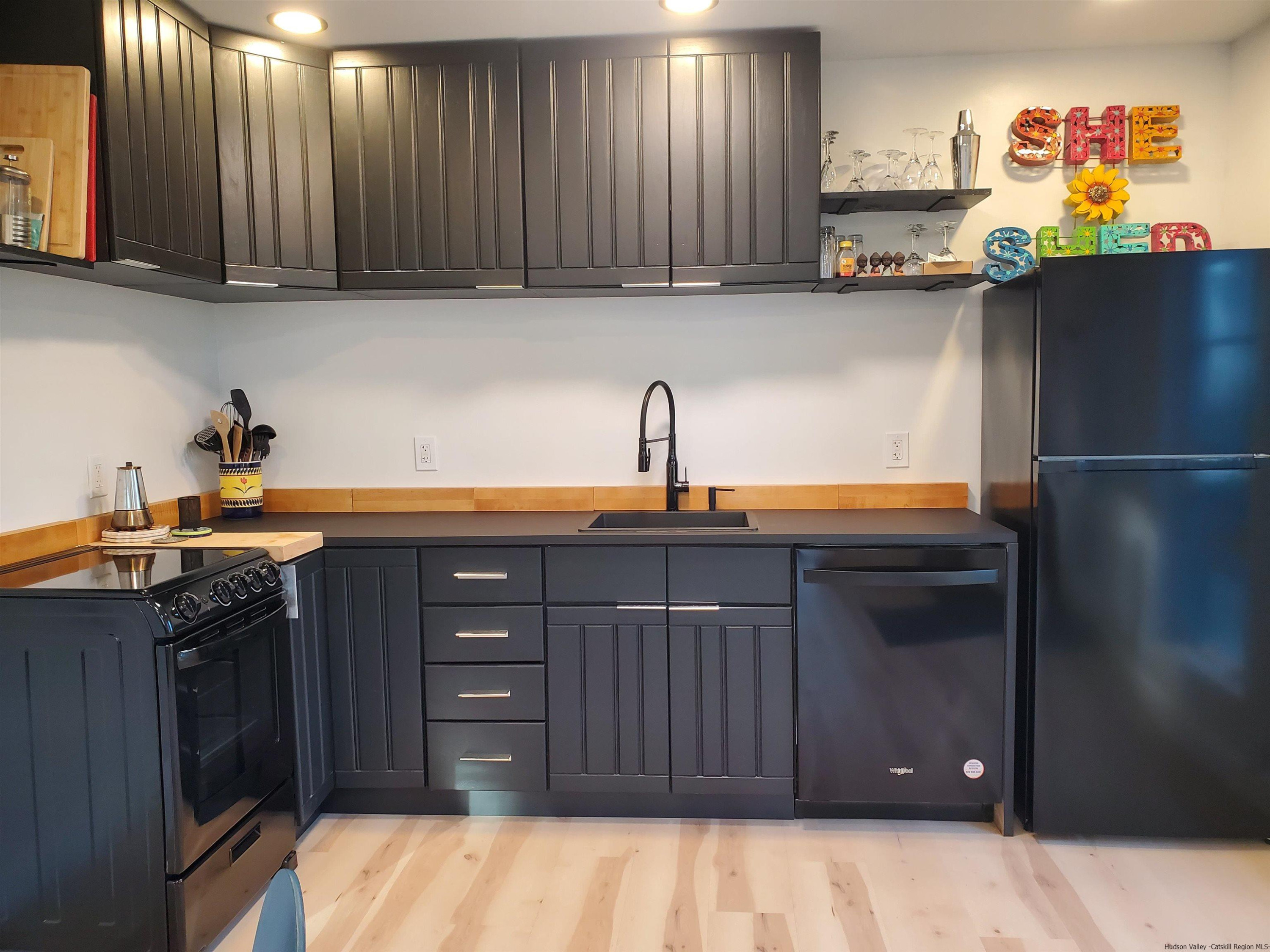 44 Dellenbaugh Road Cragsmoor, NY 12566 - Photo 4 of 12 a kitchen with a sink and cabinets