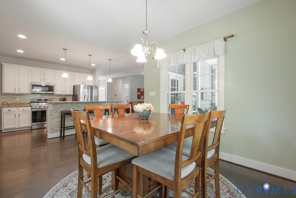 6446 Chestnut Church Road Mechanicsville, VA 23116 - Photo 16 of 49 Open-concept kitchen and dining area featuring dar