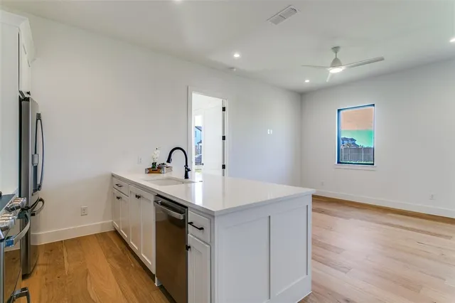 a view of a sink storage and utility room in a house
