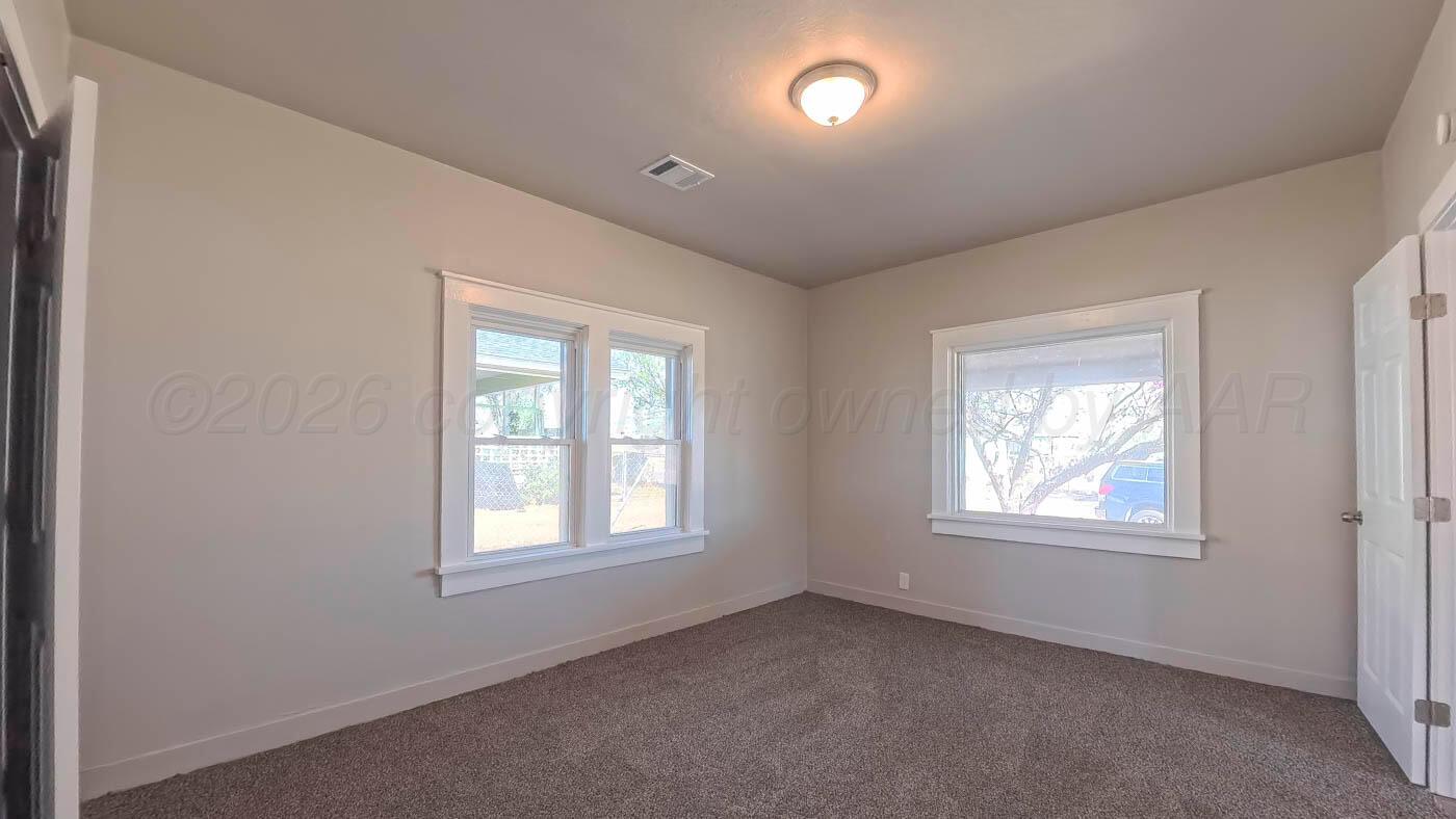 1316 Withers Avenue Amarillo, TX 79108 - Photo 16 of 19 an empty room with windows