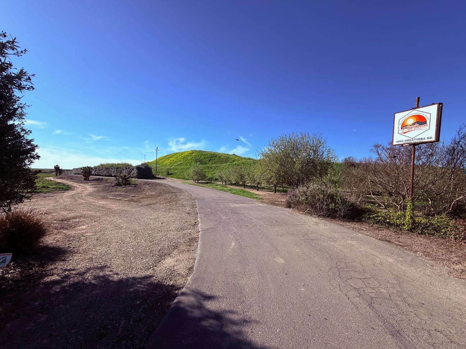 4060 Orestimba Road Newman, CA 95360 - Photo 15 of 46 a view of a road with a building in the background