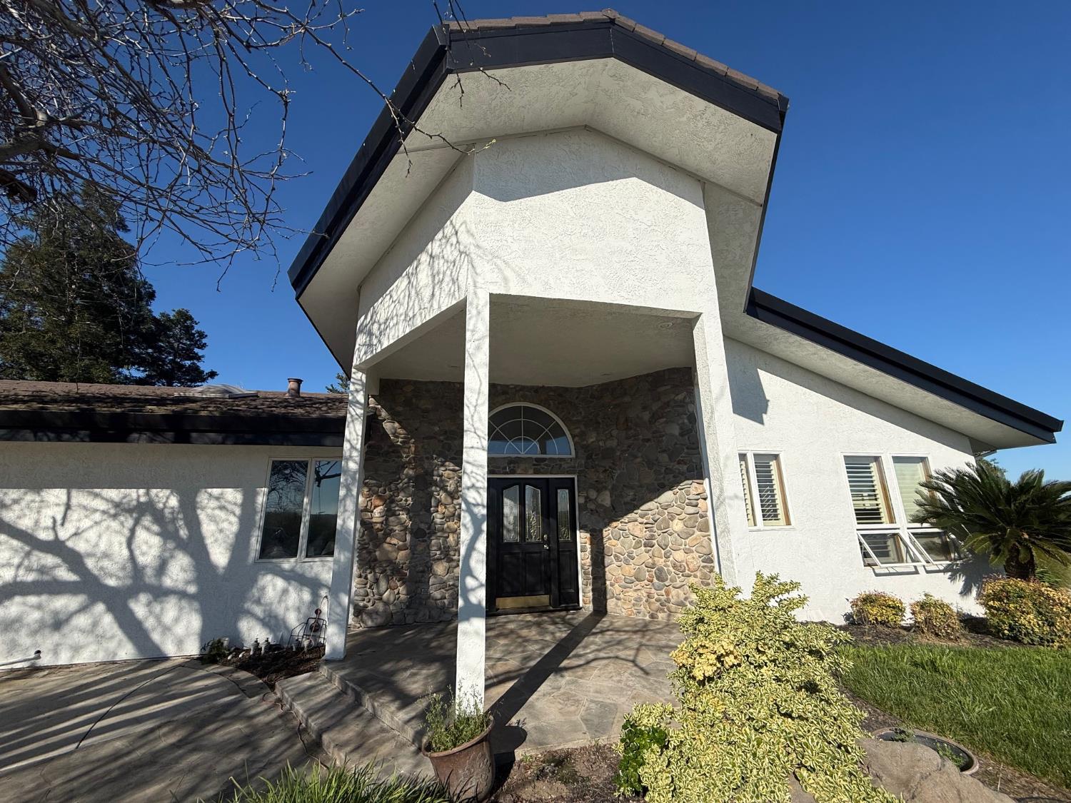 4060 Orestimba Road Newman, CA 95360 - Photo 20 of 46 a front view of a house with a yard