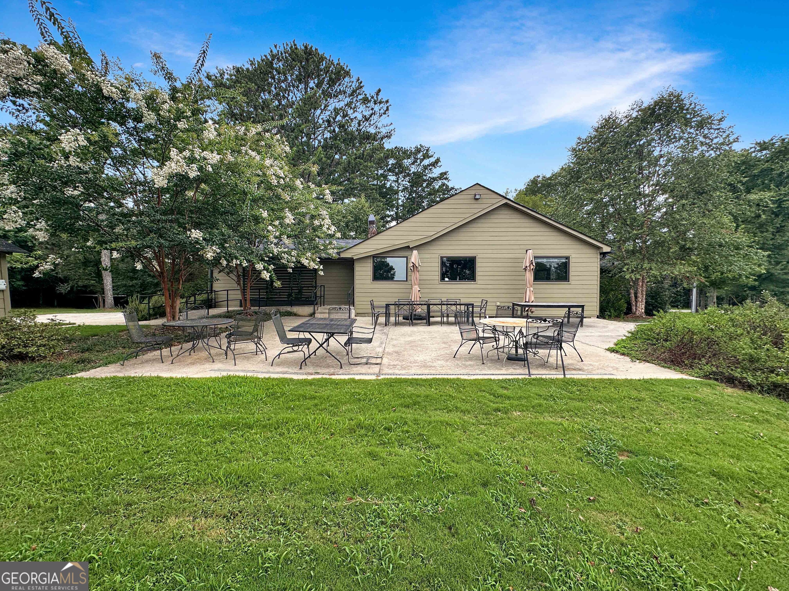 8400 Atlanta Newnan Road Chattahoochee Hills, GA 30268 - Photo 13 of 30 a view of a house with backyard and sitting area