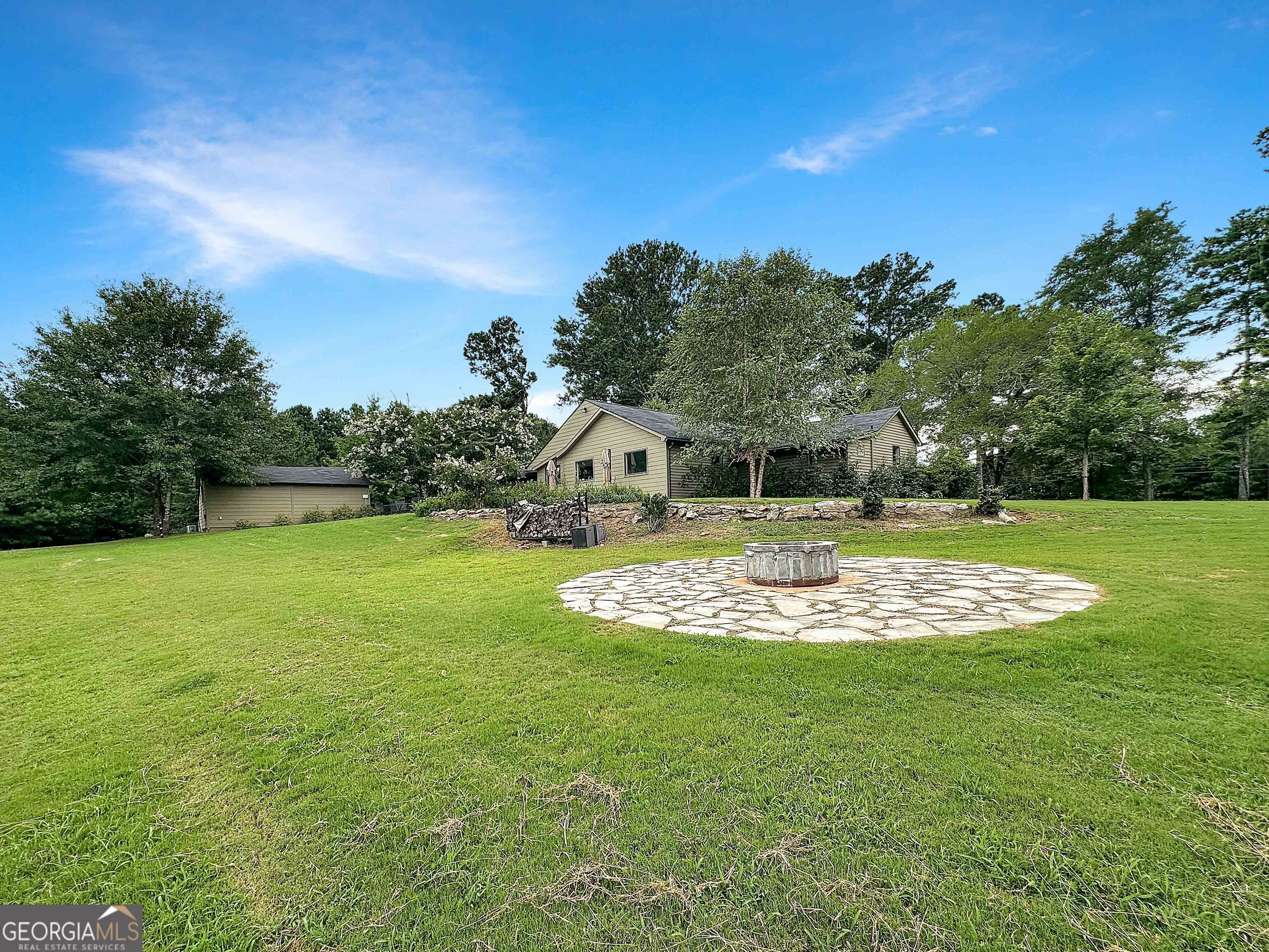 8400 Atlanta Newnan Road Chattahoochee Hills, GA 30268 - Photo 14 of 30 a view of a house with a big yard